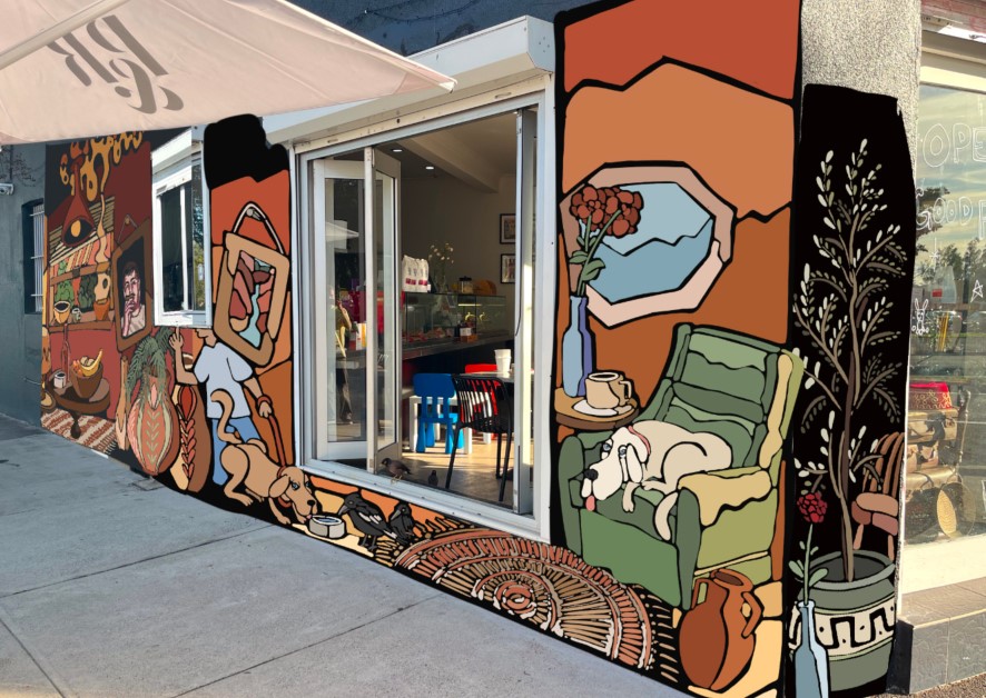 An image of a cafe wall with a colourful mural